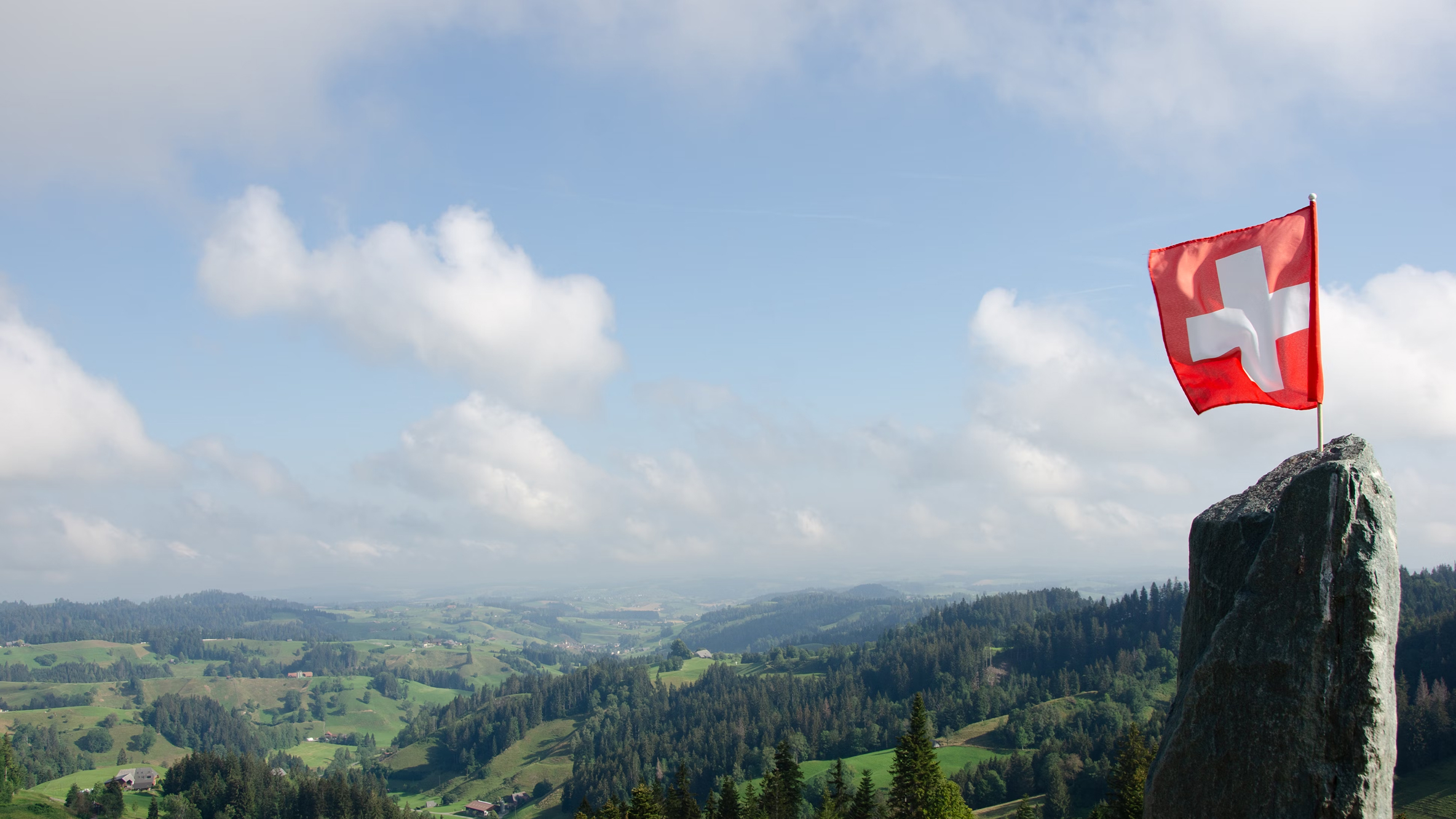 swiss-flag-and-mountains